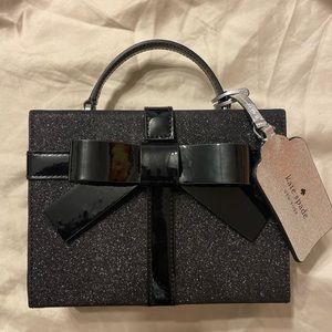 Black Kate Spade wrapping party handbag